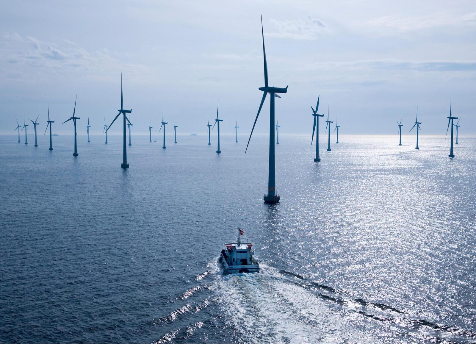 Boat passing through an offshore wind farm